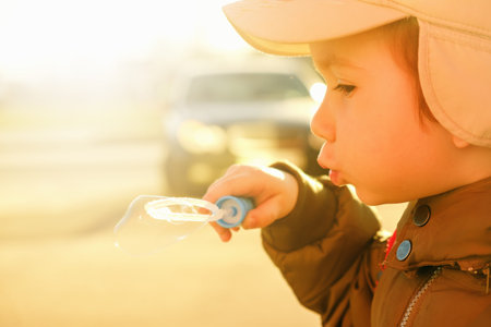 boy play with soap, blowing bubbles, cute fun happiness childhood