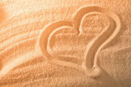 Heart in the sand on the beach. Love symboll. Concept.の写真素材