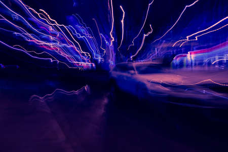 abstract image of blur motion of cars on the city road at nightの写真素材