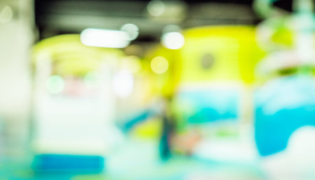 Blur image of playground in the mall, use for background.