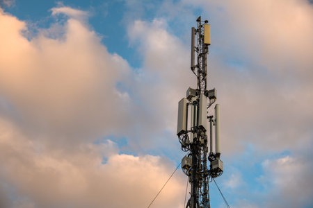 Cellular antenna. Mobile phone communication tower with blue sky background