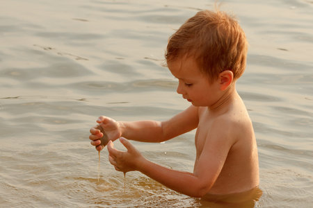 Child baby water childhood swimming summer active in lake.