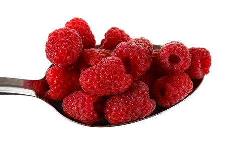 Raspberry in stainless steel spoon isolated against white background.の写真素材