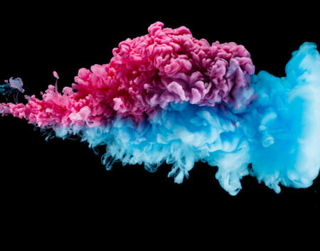 Blue and red paint splash isolated on black background close upの写真素材