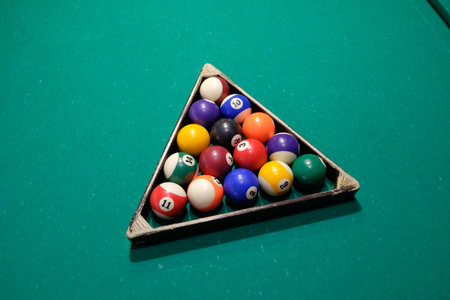 Playing billiard. Billiards balls green billiards table. Billiard sport concept. Pool billiard game.