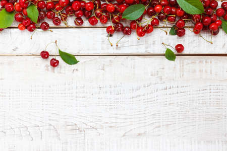 Ripe cherries on wooden table. View from above with copy spaceの写真素材