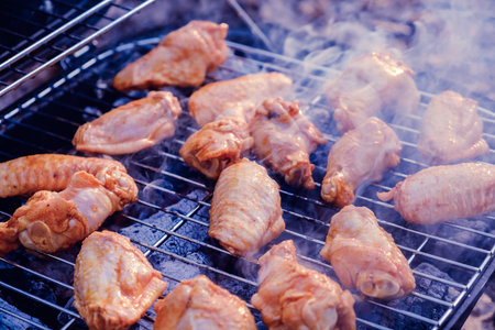 Smokehouse stands on the grass in a summer garden in nature. Smoking fish at home for your family,...