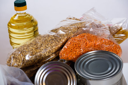 Food in a donation plastic box, isolated on white backgroundの写真素材