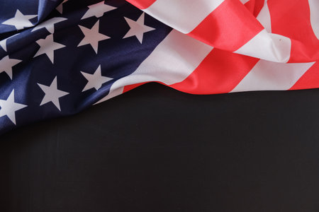 USA flag. American flag. American flag blowing wind. Close-up. Studio shot on blackboard with copy spaceの写真素材
