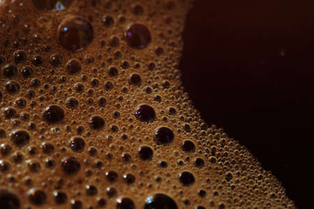 Macro of aroma coffee foam bubble backgroundの写真素材