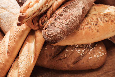 Fresh fragrant bread on the table. Food concept Wheat pastry