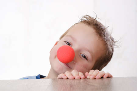 nose clown background white child boy closeup. colorful.の写真素材