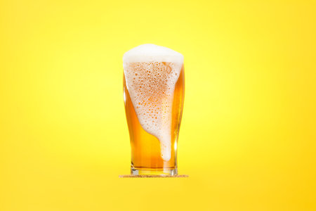 Golden beer in glass with foam, alcohol beverage drink,  lager.の写真素材