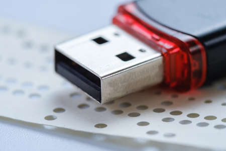 Usb flash drive and obsolete punched tape paper storage, sd. Usb flash drive and obsolete punched tape paper storage, sd.