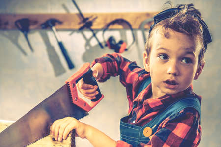 Child and fathers day, concept carpenter tool wood gift,  boy kid.の写真素材