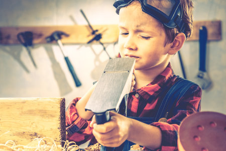 Child and fathers day, concept carpenter tool wood gift,  kid board.