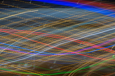Blurred motion abstract lighhts of night cityGlowing background.