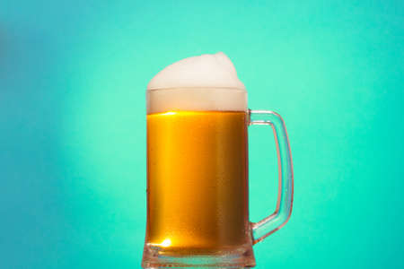 Golden cold beer in glass, foam alcohol mug, drink.Golden cold beer in glass, foam alcohol mug, drink.の写真素材