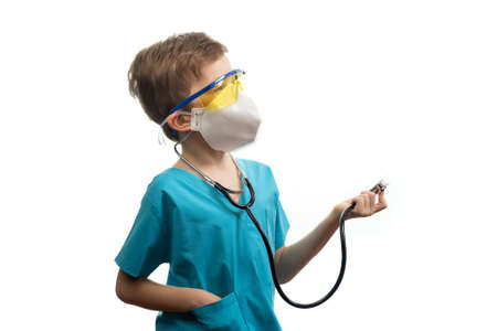 Little doctor kid boy, child on white background, medic.の写真素材