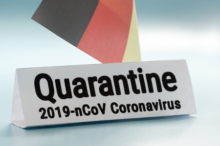 Pandemic sign warning of quarantine due to Covid-19 or corona virus in the Germany using a German...