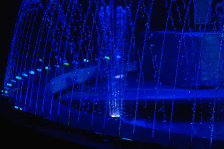 Fountain water night city color blue evening, reflection.の写真素材
