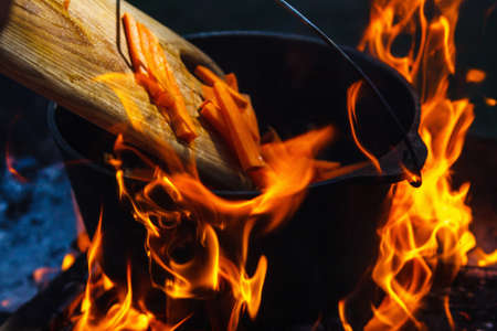 Bowler cooking food bonfire cauldron camp fire, campfire smoke.の写真素材