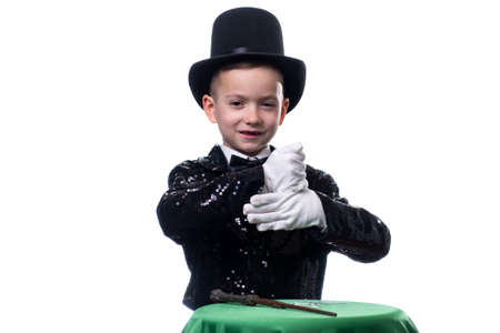 Magician kid illusionist boy in hat, magic show. young costume isolated white backgroundの写真素材