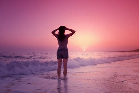 silhouette Happy woman silhouette sea sunset summer ocean. sky relaxationの写真素材