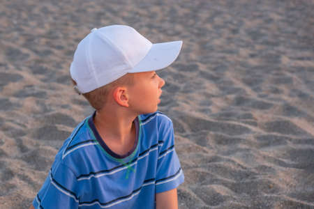 Child play sand summer ocean vacation sea. boy caucasianの写真素材