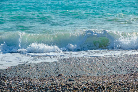 Ocean wave with spray, sea summer blue surf. reflectionの写真素材