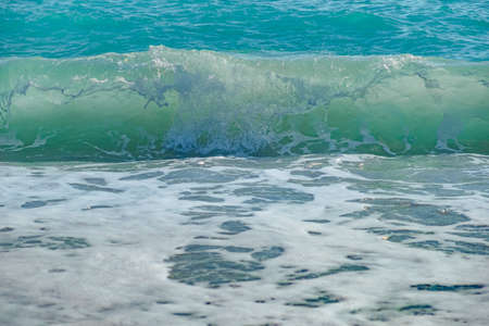 Ocean wave with spray, sea summer blue surf. travelの写真素材