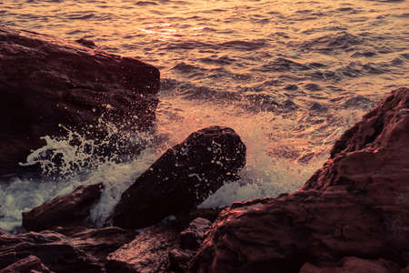 Sunset beach ocean wave splash summer storm. waterの写真素材