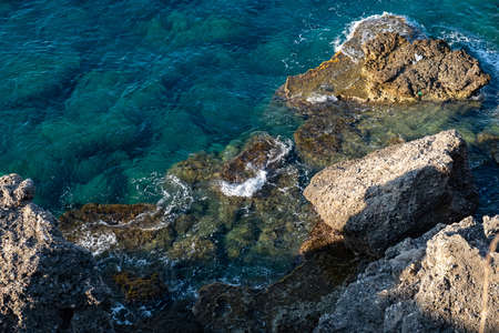 Sea or ocean beach with wave and spray, water on rock. storm foamの写真素材