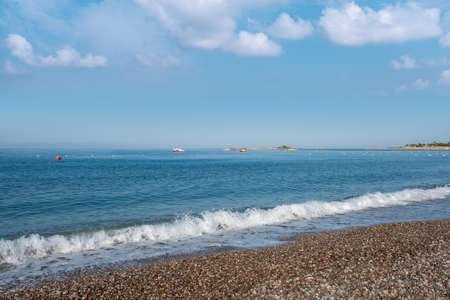 Ocean wave with spray, sea summer blue surf. liquid skyの写真素材