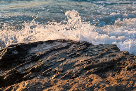Sunset beach ocean wave splash summer storm. coast seaの写真素材