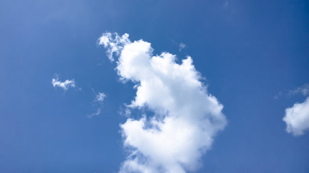 A background of a cloudy blue sky