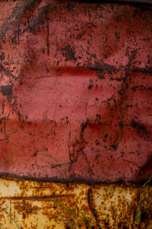 Old rusty barrel with peeling paint, textureの写真素材