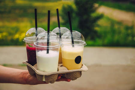 Refreshing summer drinks take-away from a coffee shop. Milkshake, coffee and smoothie.の写真素材