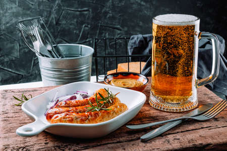 Delicious bavarian sausages with glass of beer on the table. High quality photoの写真素材