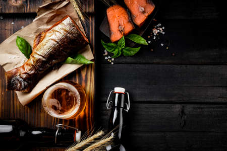 Light beer and salted red fish, top view, free space for your textの写真素材