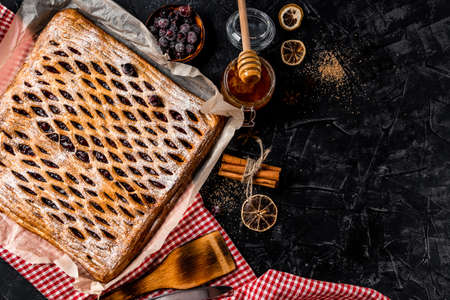 Big sweet homemade pie with berries on a black background, top view, free space for text. High quality photoの写真素材