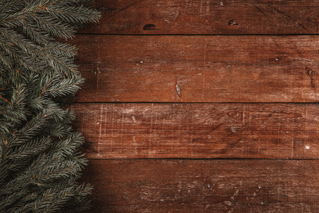 Textured wooden background with fir branches, beautiful christmas background with empty space for text. High quality photoの写真素材