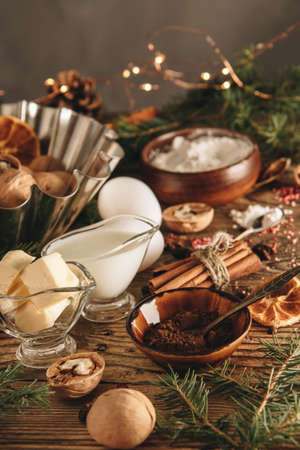 Ingredients for making a Christmas cupcake on the table, vertical photoの写真素材