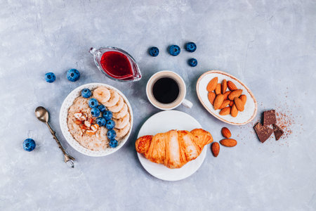 Healthy breakfast - oatmeal, growing and coffee on a gray background. High quality photoの写真素材