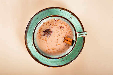 Masala tea. Indian traditional tea with milk and spices in a cup top viewの写真素材