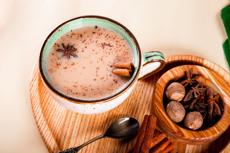 A cup fo masala tea. Indian traditional tea with milk and spices in a cup close upの写真素材