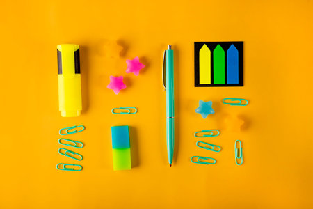 Stationery on yellow background, back to school concept. High quality photo