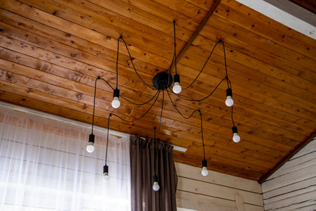 Simple chandelier spider in a wooden house. High quality photoの写真素材