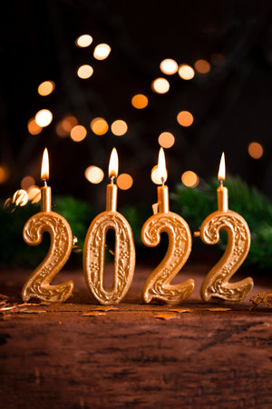 Advent candles in the form of numbers 2022. Cards for New Year and Christmas 2022 vertical photo