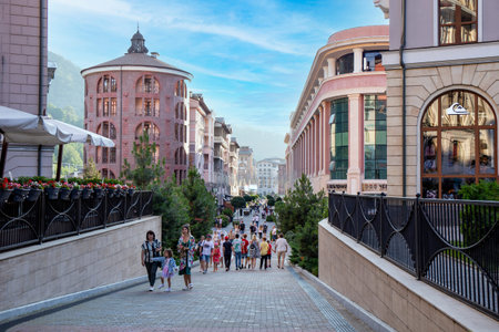 People are walking in Rosa Khutor village in the mountains. Resort in Sochi. Russia, Sochi 14.07.21